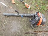 an image of a blower and other tools on the ground