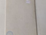 a notepad sitting on a table with a sticker on it