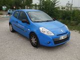 a blue car that is parked in a parking lot