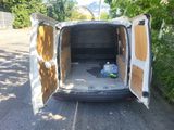 a van that is parked on the side of the road
