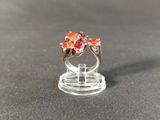 a ring that is sitting on top of a clear stand