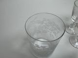 three wine glasses sitting next to each other on a table