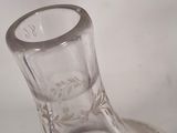 a clear glass vase sitting on a table