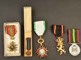 several medals and medals are displayed in a box on a table