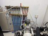 a machine that is sitting on the floor next to a radiator