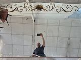 a man that is taking a picture of himself in the mirror