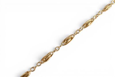 a close up of a gold chain on a white background