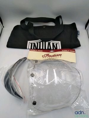 a bag and a pair of headphones sitting on a table