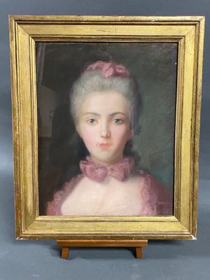 portrait of a woman in a pink dress in a gold frame