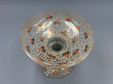 un vase en verre orné de pois orange et jaunes
