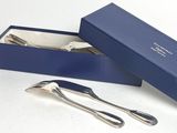 two forks and a spoon in a blue box