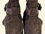 brown sued ankle boots with buckles and buckles on the side