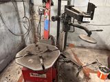 a machine that is sitting in a garage with tools