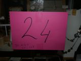a pink sign with the number 24 written on it