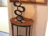 a table with a lamp on top of it in a room