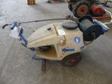a machine that is sitting on the ground in the garage