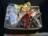 a box full of assorted items sitting on a chair