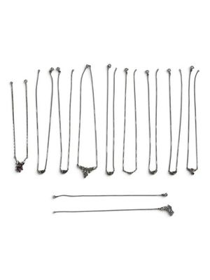 many different types of necklaces on a white background