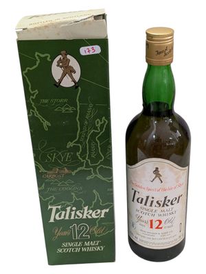 an image of a bottle of whisky next to a box