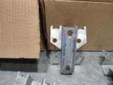 a box and a pair of screws on the floor