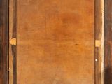 an old wooden frame with a painting hanging on it ' s side