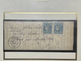 an old envelope with a stamp on it sitting on a table