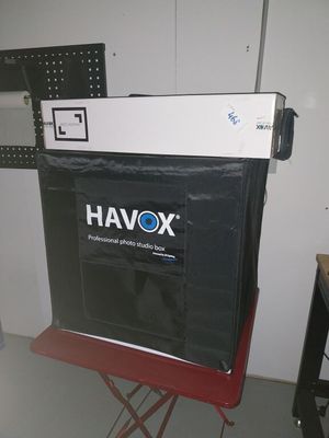 a black box sitting on top of a red chair