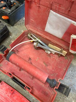 a red tool box with tools in it on the floor