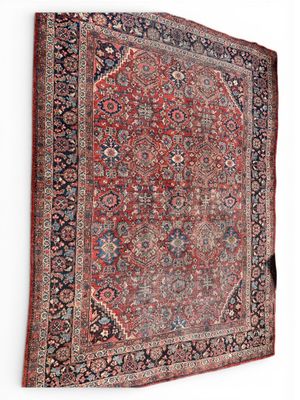 an antique persian rug on a white background