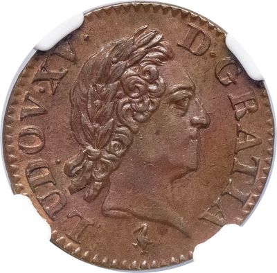 gros plan d'une pièce de monnaie sur laquelle figure une tête de femme