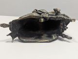 an antique bronze figurine of a cow with a rider on it ' s back
