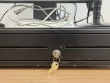 an image of a cash register with a key on it