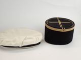 a black hat and a white hat sitting on a table