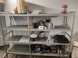 a metal shelf with pots and pans on top of it