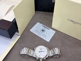 a watch that is sitting on a table next to a box