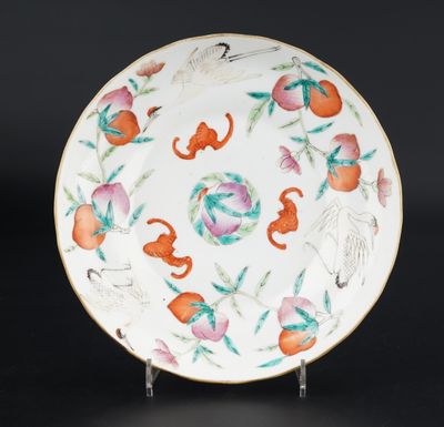 a white plate with oranges and monkeys on it