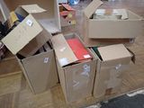 many boxes that are sitting on the floor in the room