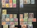 an assortment of stamps and stamps on display in a display case