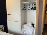 a bed and a closet in a small room