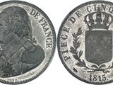 a close up of a coin with a crown on top of it