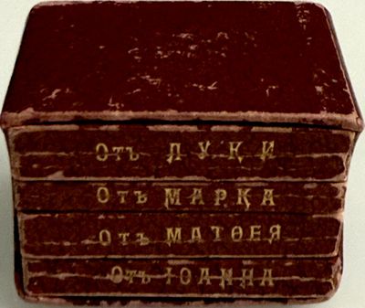a stack of old books sitting on top of a table