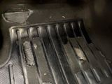 a close up of a car floor with a dirty floor mat