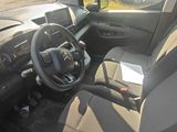a view of the inside of a car from the driver ' s seat