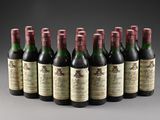 six bottles of wine are lined up in a row on a table