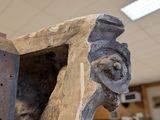 a close up of a wooden bench in a building