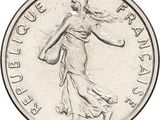 an image of a silver coin with a woman holding a basket