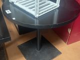 a black table with a white shelf on it
