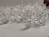 a lot of clear glass vases sitting on a table