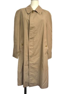 a women ' s trench coat on a mannequin mannequin