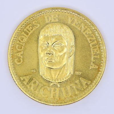 an image of a gold coin with a picture of a man ' s face on it